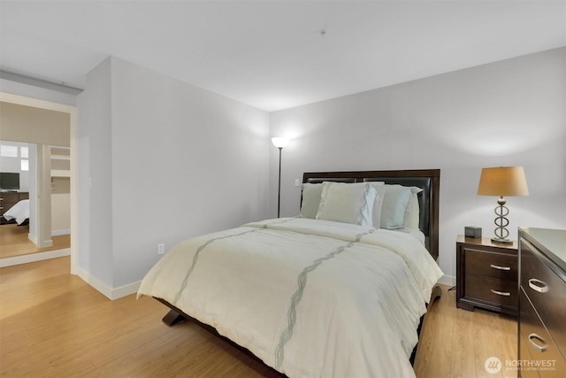300 110th Ave NE # 611, Bellevue, WA 98004 - bedroom featuring baseboards and light wood-style floors