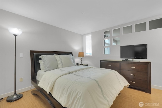 300 110th Ave NE # 611, Bellevue, WA 98004 - bedroom with light wood-type flooring and baseboards