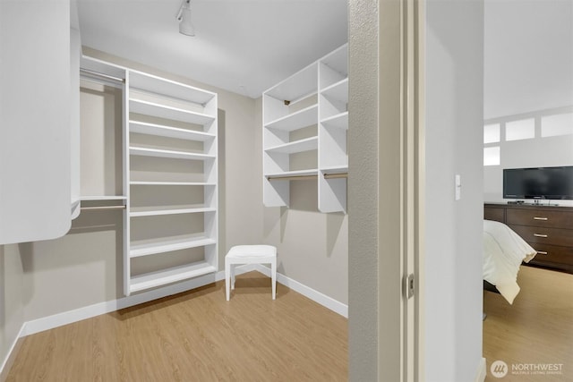 300 110th Ave NE # 611, Bellevue, WA 98004 - walk in closet featuring wood finished floors