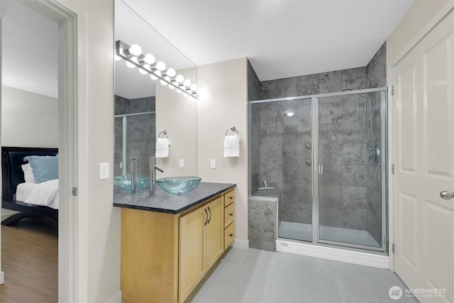 300 110th Ave NE # 611, Bellevue, WA 98004 - full bathroom featuring vanity, a stall shower, and connected bathroom