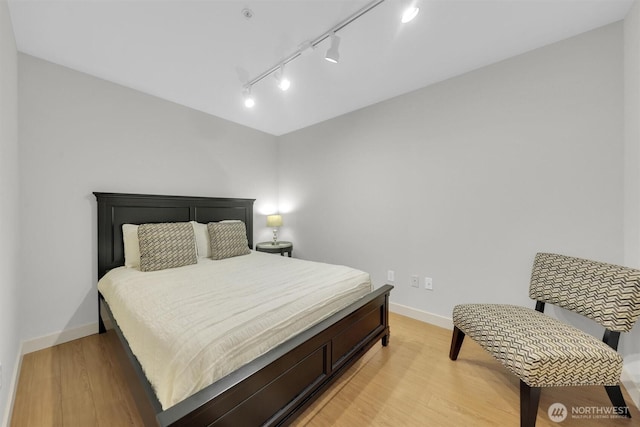 300 110th Ave NE # 611, Bellevue, WA 98004 - bedroom featuring light wood-type flooring and baseboards
