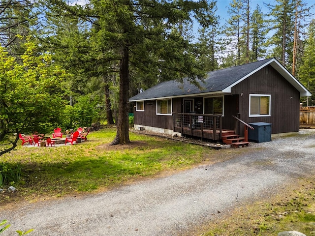 25312 Saddle St, Leavenworth, WA 98826 - view of front of property featuring an outdoor fire pit, a porch, and a shingled roof