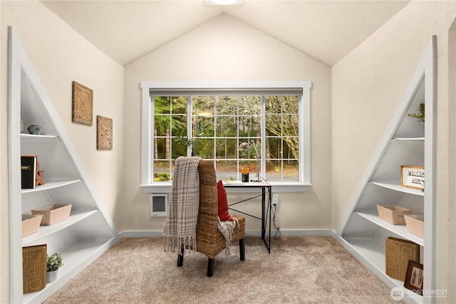 office area featuring heating unit, built in shelves, carpet, baseboards, and lofted ceiling