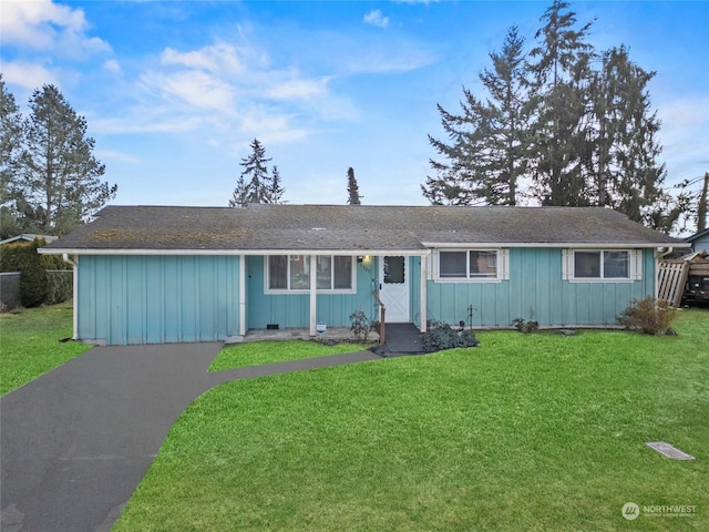 ranch-style house with a front lawn