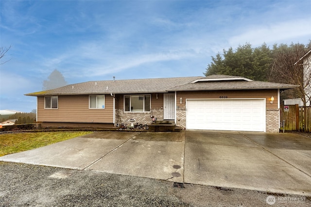 single story home featuring concrete driveway, brick siding, and an attached garage