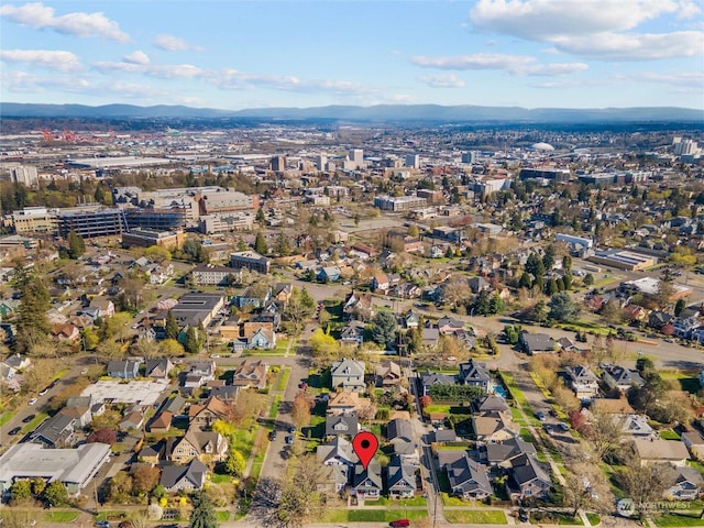 birds eye view of property featuring a mountain view