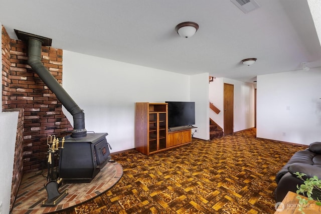 living room featuring a wood stove