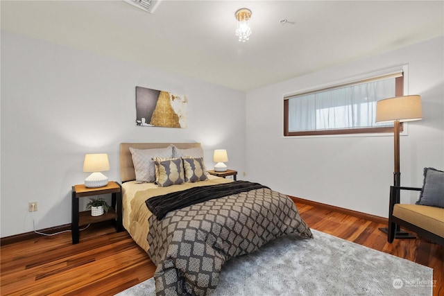 bedroom featuring dark hardwood / wood-style floors