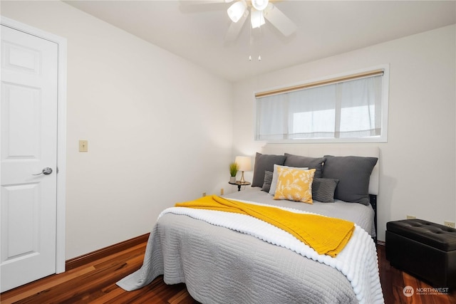 bedroom with dark wood-type flooring and ceiling fan