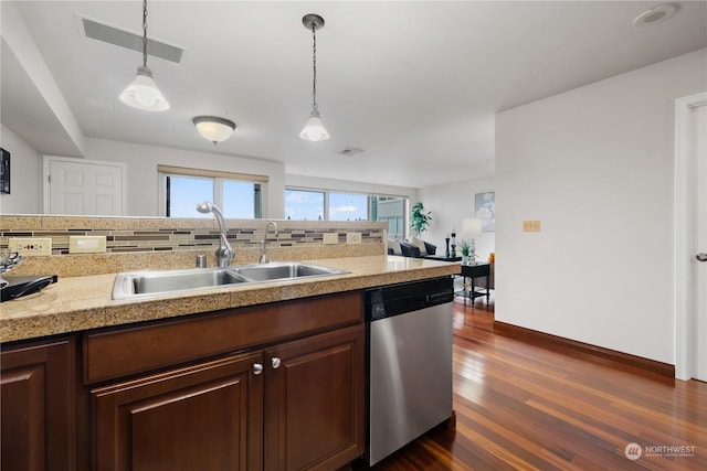 kitchen with stainless steel dishwasher, decorative light fixtures, dark hardwood / wood-style flooring, and sink