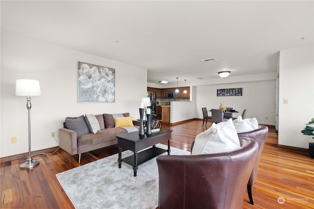 living room with wood-type flooring