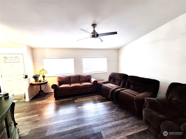 living room with ceiling fan and dark hardwood / wood-style floors