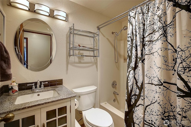 full bathroom featuring shower / bathtub combination with curtain, vanity, and toilet