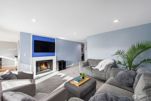 carpeted living room featuring a baseboard radiator