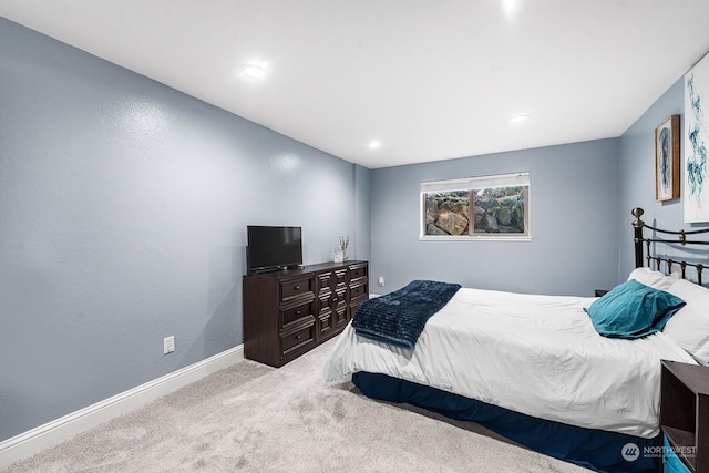 bedroom with light colored carpet