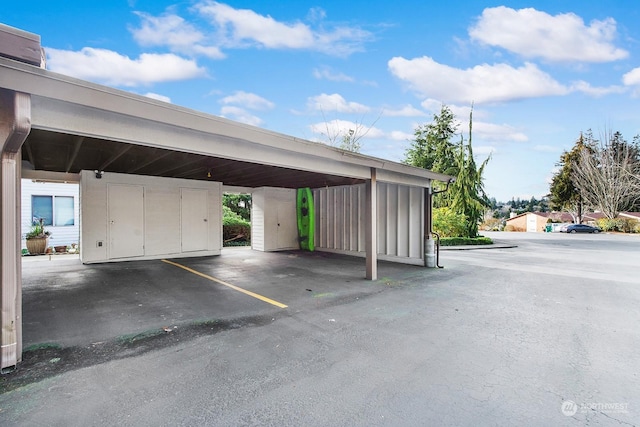 exterior space with a carport