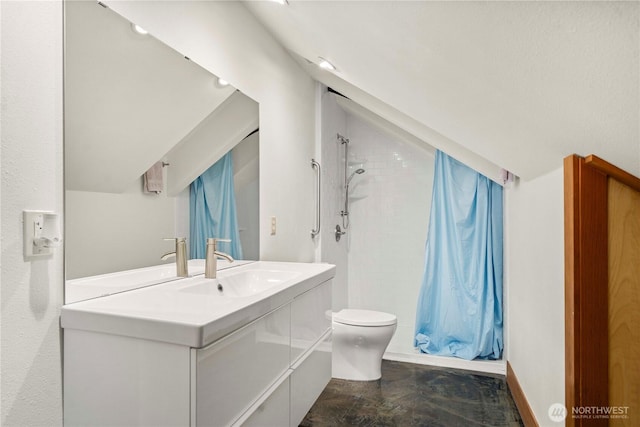 bathroom with toilet, curtained shower, vaulted ceiling, and vanity