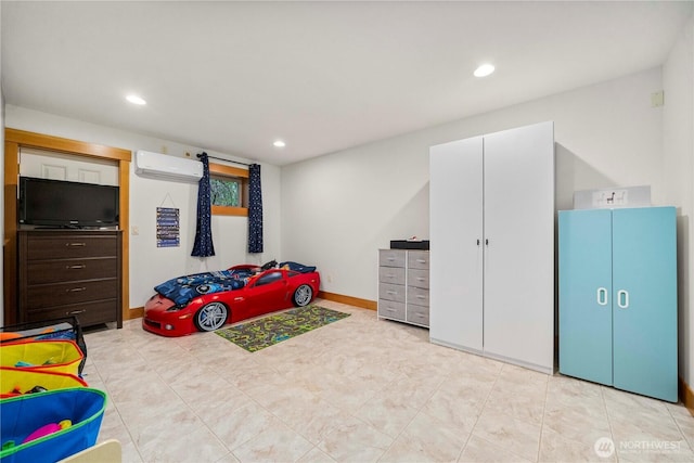 bedroom featuring baseboards, an AC wall unit, and recessed lighting