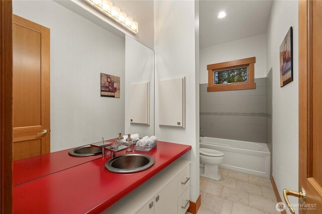 full bathroom featuring vanity, toilet, and tile patterned floors