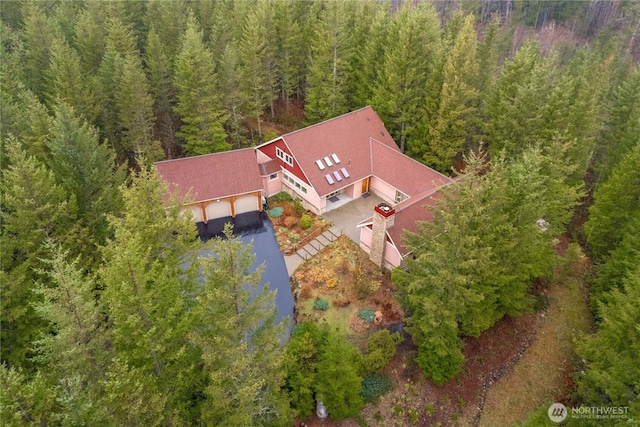 aerial view featuring a wooded view