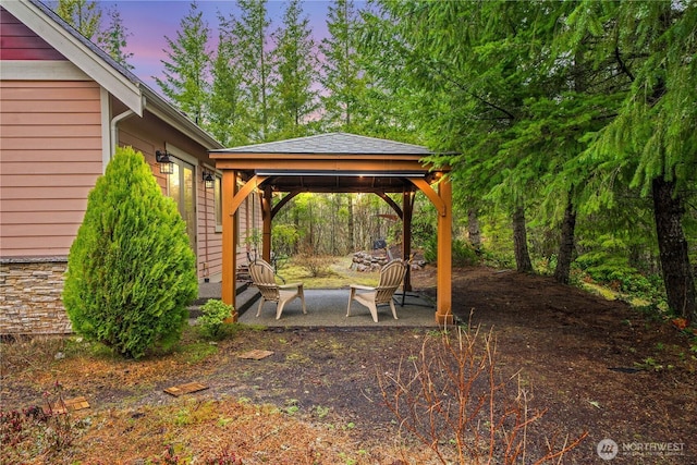 view of yard featuring a gazebo and a patio area