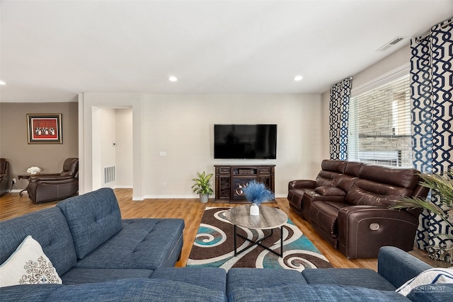 living room with light hardwood / wood-style floors