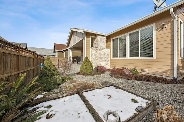 view of property exterior with a patio area