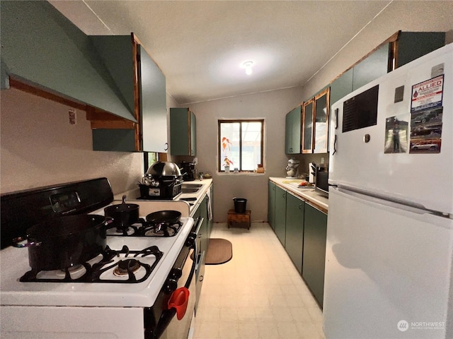 kitchen with white appliances and wall chimney exhaust hood