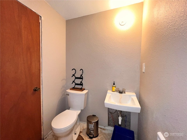 bathroom with sink and toilet