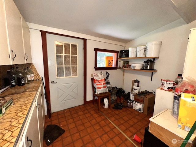 kitchen featuring white cabinets