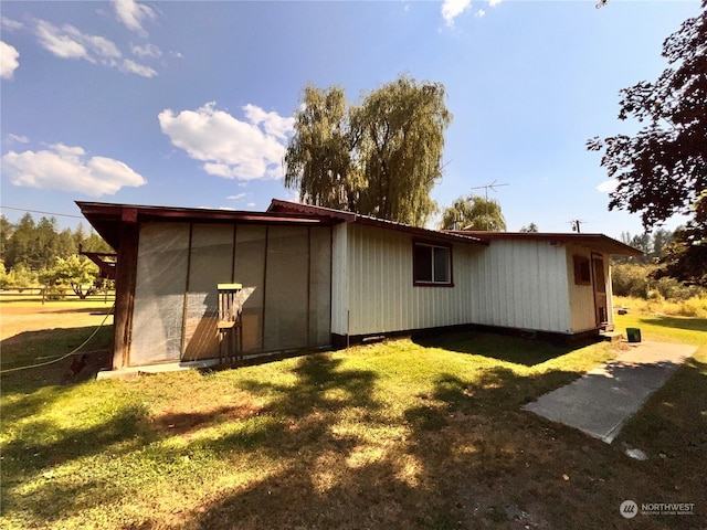 rear view of house with a lawn