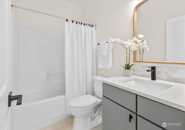 full bathroom with vanity, toilet, tile patterned flooring, and shower / bath combo with shower curtain