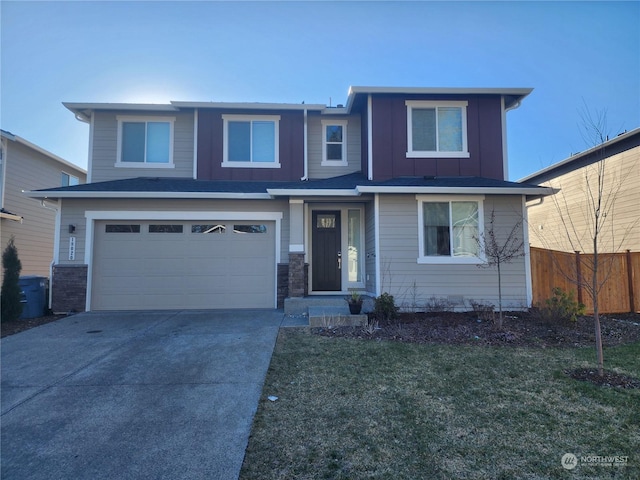 view of front of home featuring a garage and a front lawn