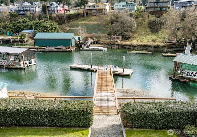 dock area featuring a water view and a residential view