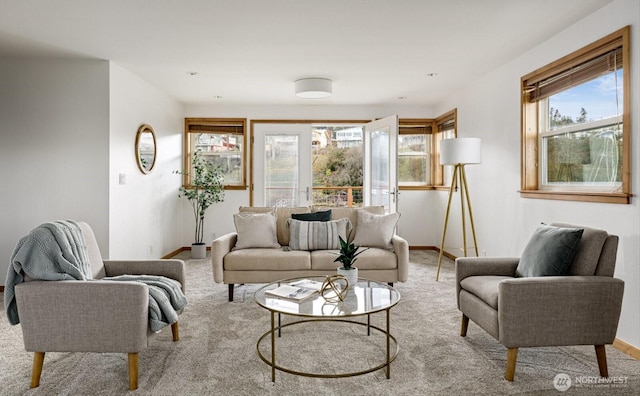 interior space featuring baseboards and light colored carpet