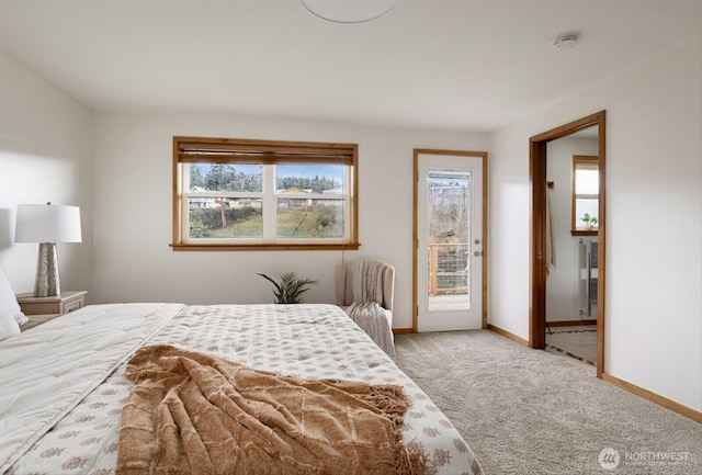 bedroom featuring light carpet, access to outside, and baseboards