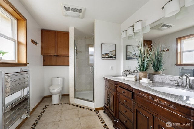 full bathroom with baseboards, visible vents, a sink, and a shower stall