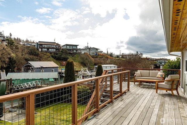 wooden terrace featuring an outdoor living space