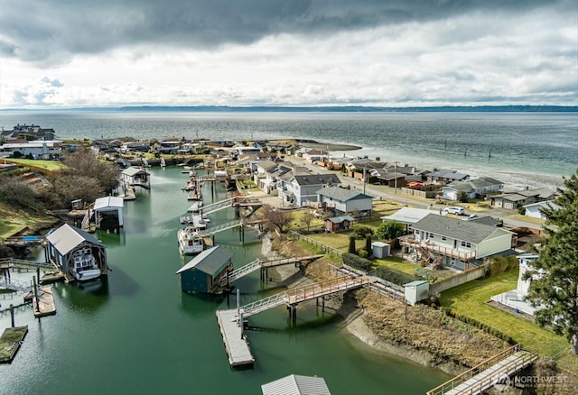 bird's eye view featuring a water view and a residential view