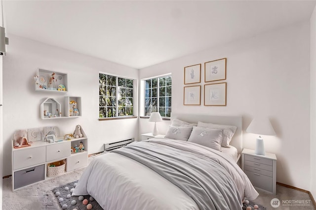 bedroom featuring carpet floors and baseboard heating