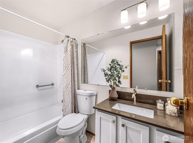 full bathroom with vanity, shower / bath combination with curtain, and toilet