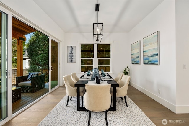 dining area featuring baseboards and wood finished floors