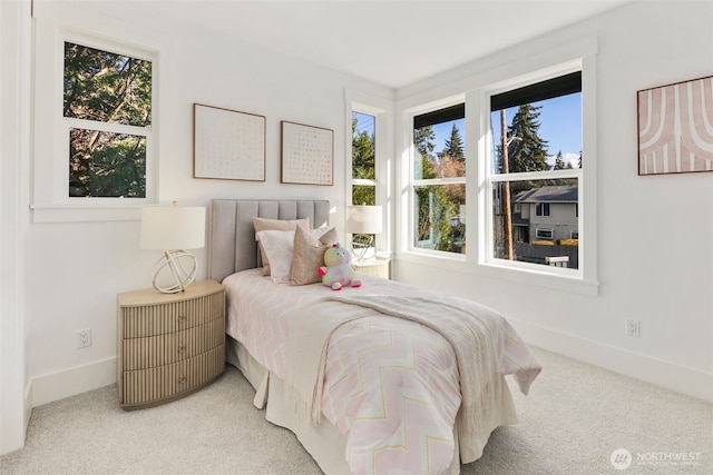 bedroom with carpet flooring and baseboards