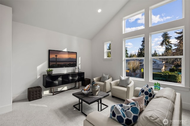 living area featuring carpet, high vaulted ceiling, baseboards, and recessed lighting