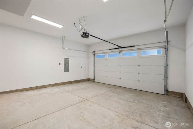 garage featuring baseboards, electric panel, and a garage door opener