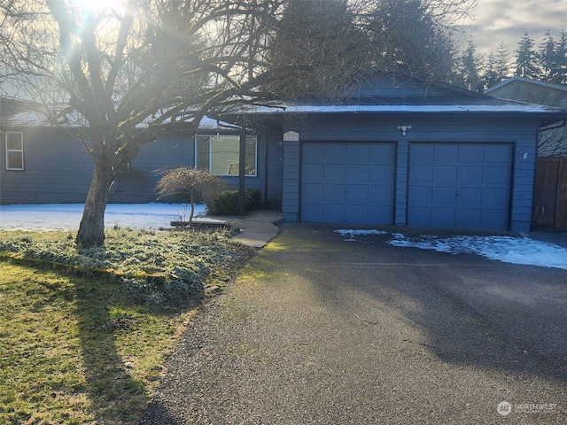 ranch-style home with a garage