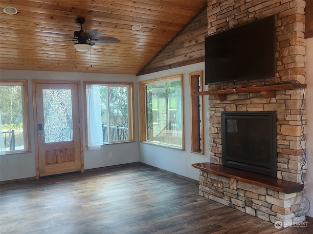 unfurnished living room featuring dark wood-type flooring, wooden ceiling, and a wealth of natural light