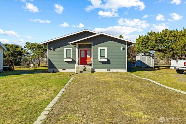 bungalow with a shed and a front yard