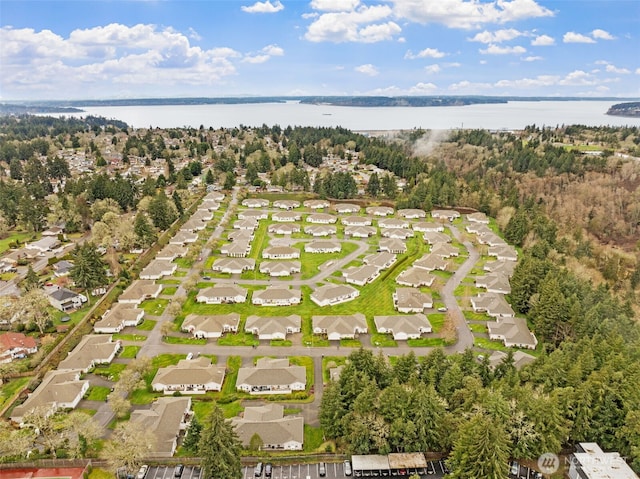 birds eye view of property featuring a residential view and a water view