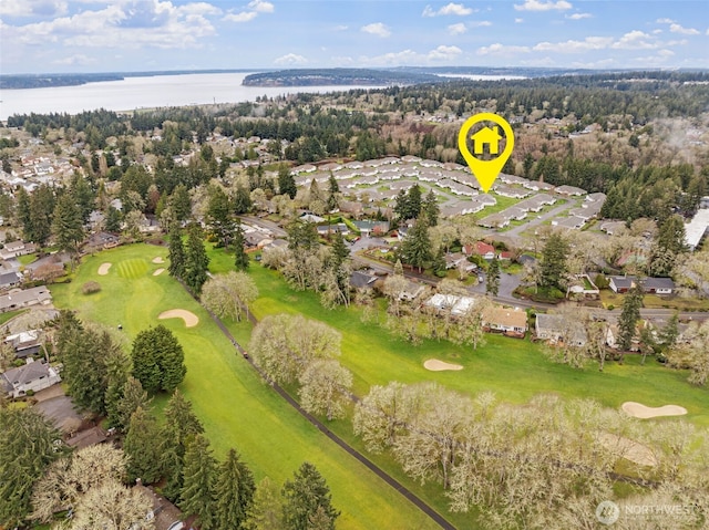 bird's eye view featuring view of golf course and a water view